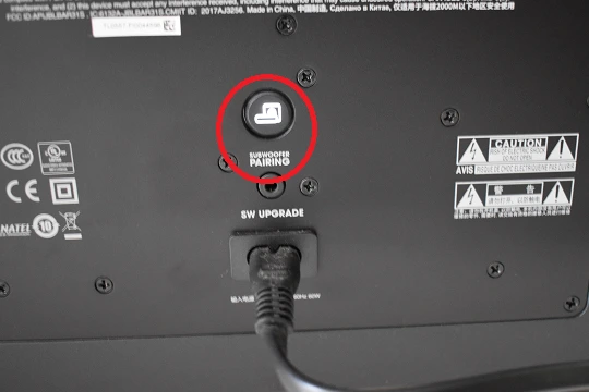 PAIRING button on the back of the subwoofer